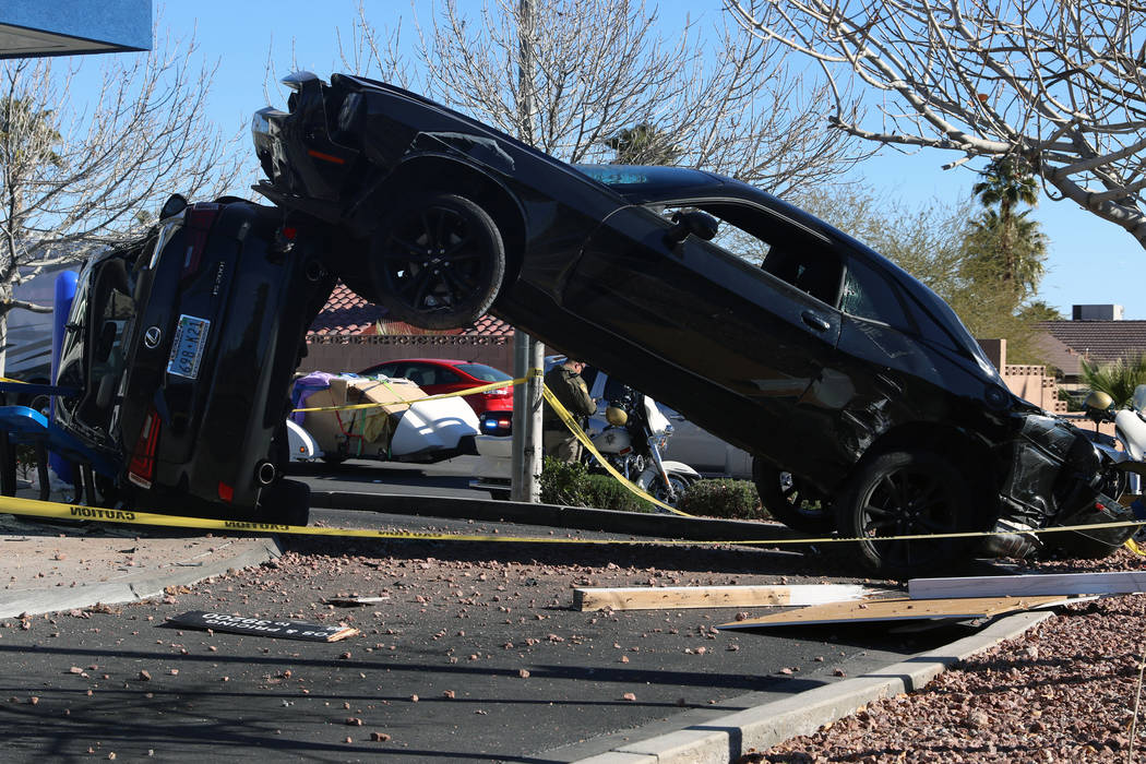 A crash outside a Dutch Bros coffee shop at 590 E. Windmill Lane left one vehicle on its side a ...