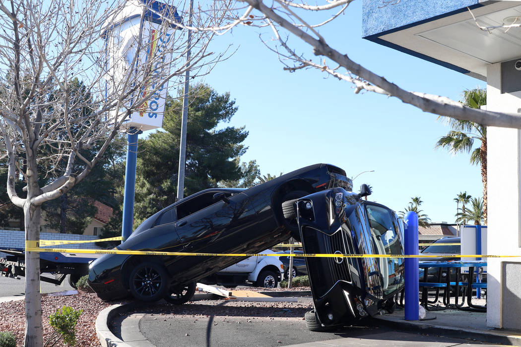 A crash outside a Dutch Bros coffee shop at 590 E. Windmill Lane left one vehicle on its side a ...