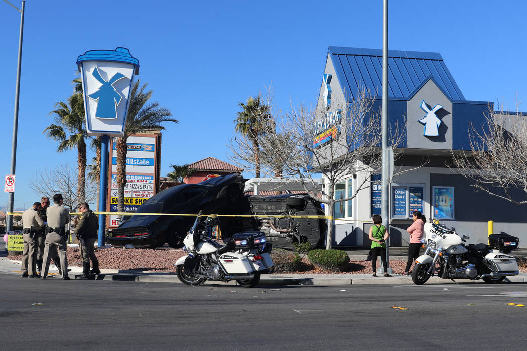 A crash outside a Dutch Bros coffee shop at 590 E. Windmill Lane left one vehicle on its side a ...