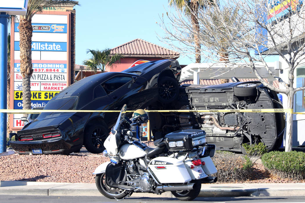 A crash outside a Dutch Bros coffee shop at 590 E. Windmill Lane left one vehicle on its side a ...