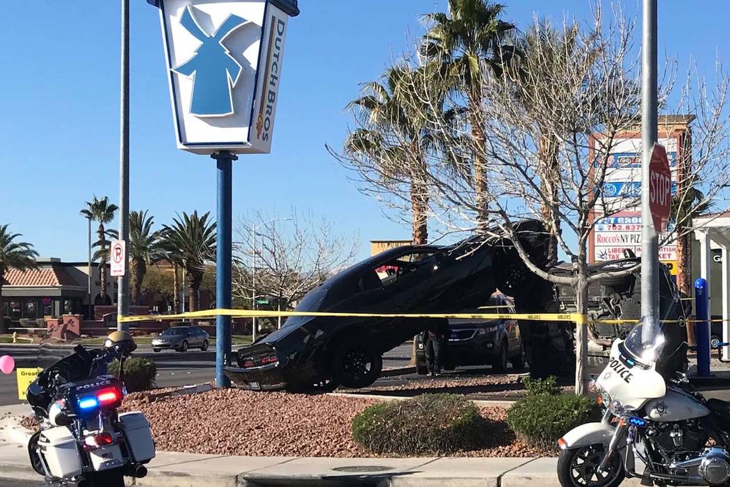 A crash outside a Dutch Bros coffee shop at 590 E. Windmill Lane left one vehicle on its side a ...