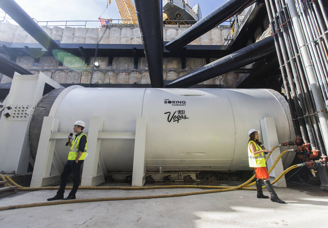 Media get a first glimpse at a tunnel boring machine at the future location of one of the under ...