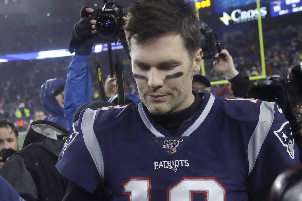 New England Patriots quarterback Tom Brady leaves the field after losing to the Tennessee Titan ...