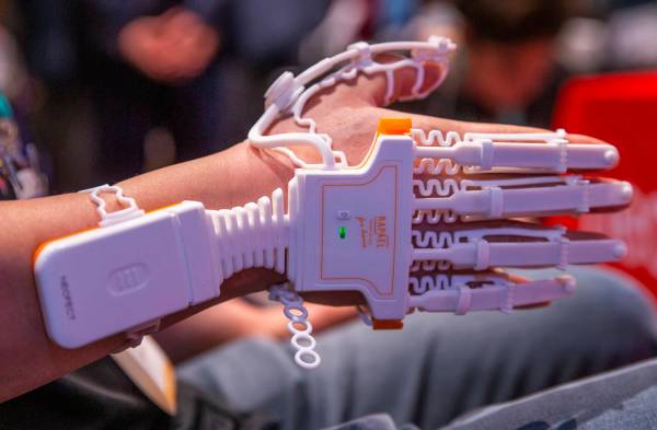 Poh Oh demonstrates the Neofect Smart Glove for injury rehabilitation during Pepcom's Digital E ...