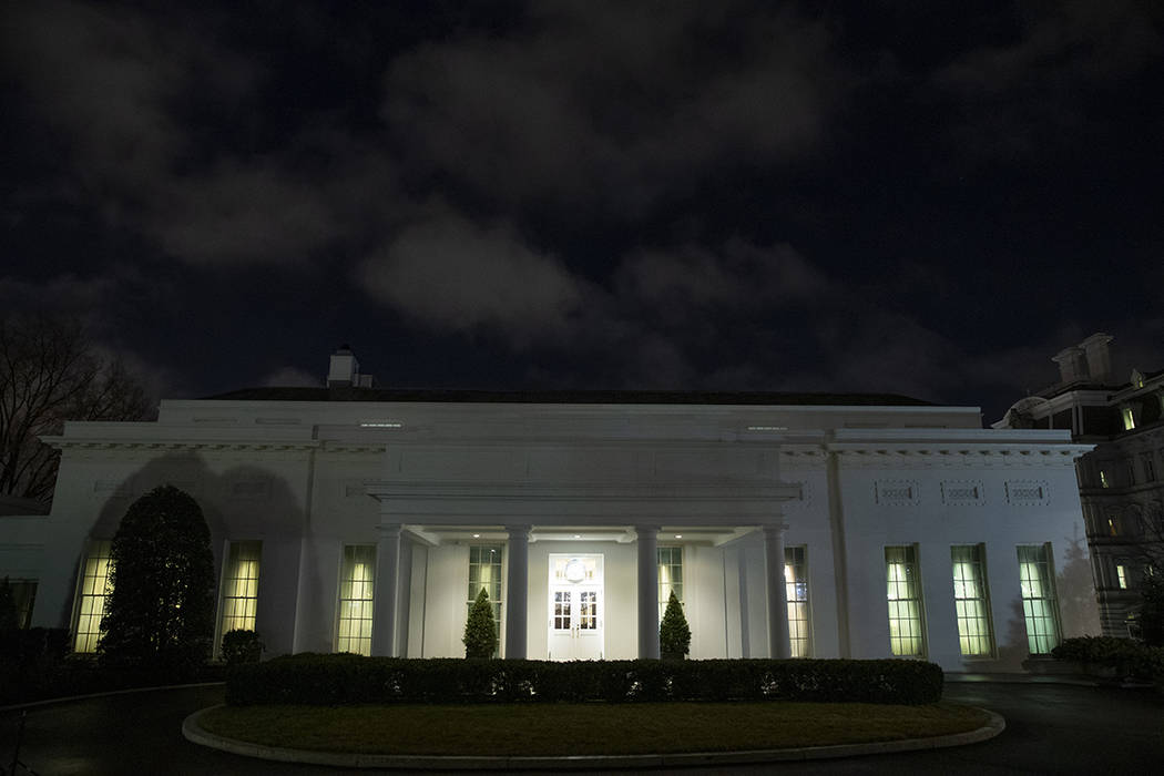 All the lights are on in the windows of the West Wing of the White House after news of a missil ...