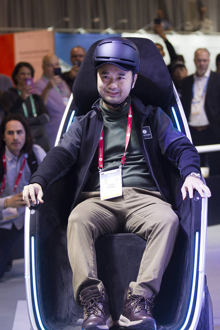 Segway Vice President Chen Huang demonstrates the S-Pod transporter at CES at the Las Vegas Con ...