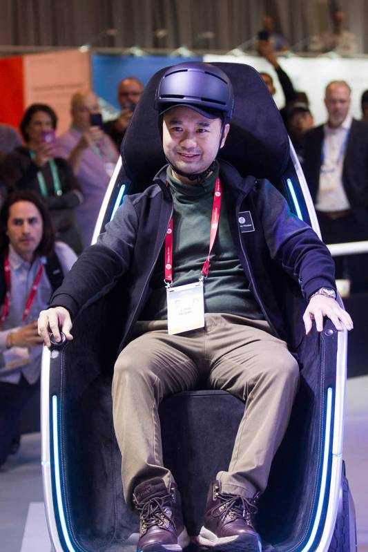 Segway Vice President Chen Huang demonstrates the S-Pod transporter at CES at the Las Vegas Con ...