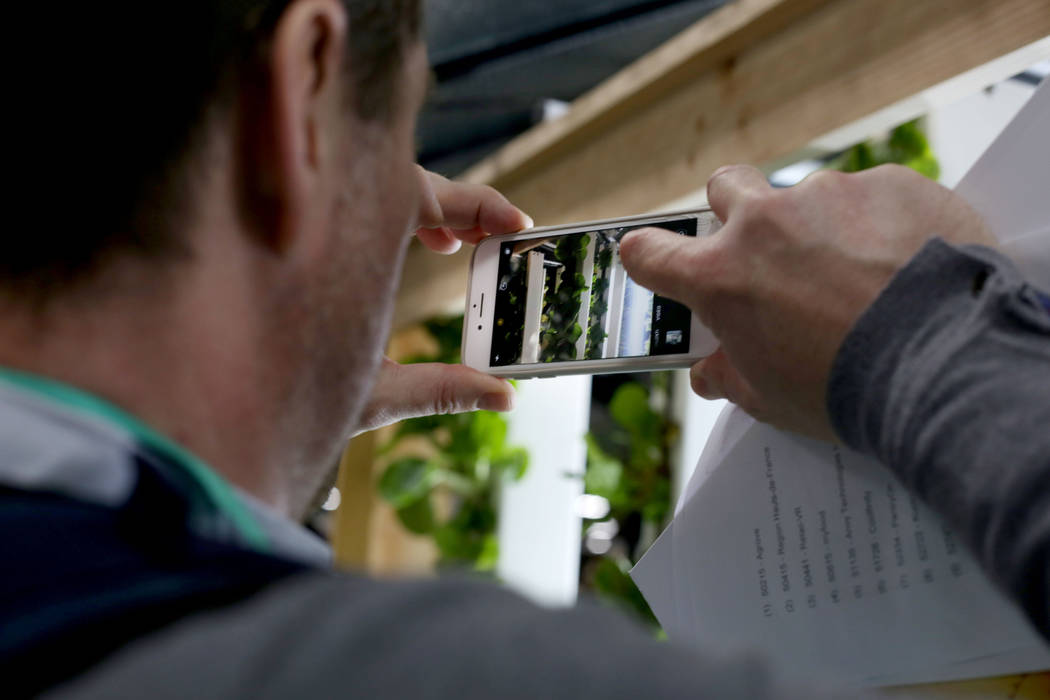 Xavier Blocquel of Paris, France with Adix takes a photo of a smart green house by Myfood durin ...