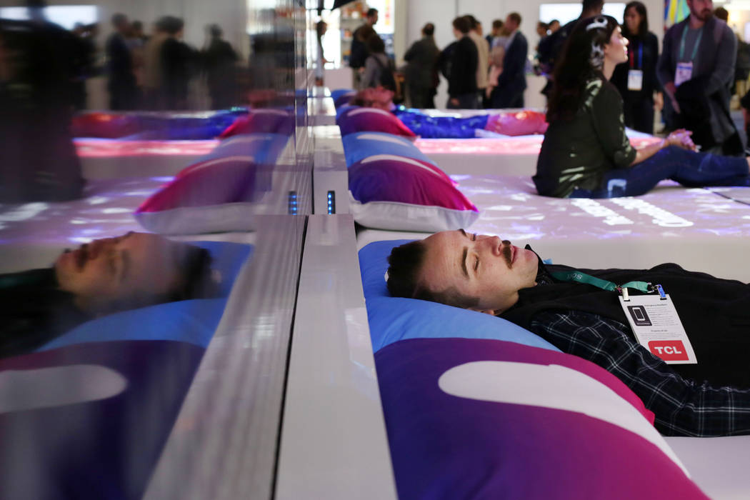 John Reynolds of Calif, with Flexport lays on a CLIMATE360 Smart Bed by Sleep Number during the ...