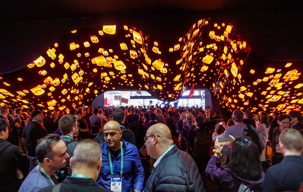 Attendees stream through the main entrance for Central Hall during CES Day 1 at the Las Vegas C ...