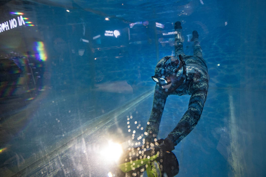 A man demonstrates the Seabow underwater scooter made by Sublue at CES at the Las Vegas Convent ...