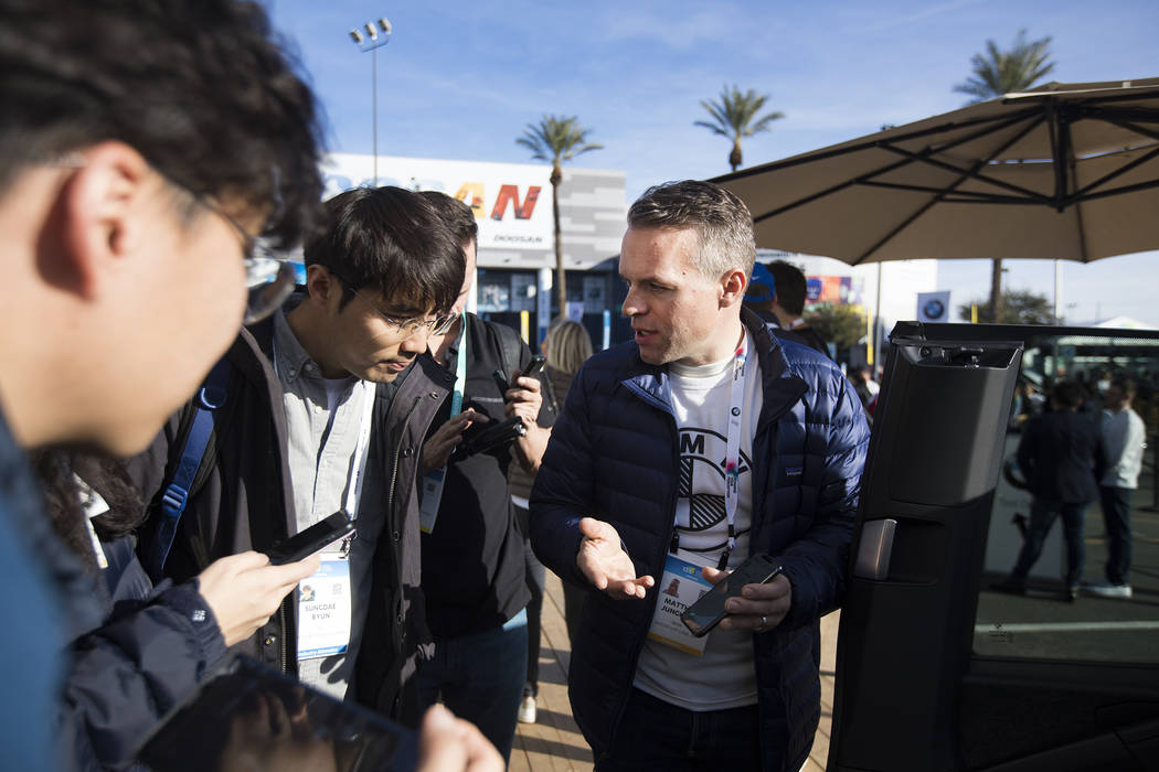 Matthias Junghans, head of BMWճ interior design, speaks to attendees about the i3 Urban S ...