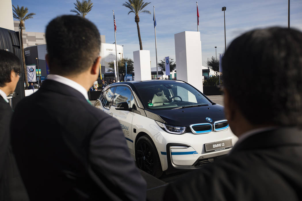 The BMW i3 Urban Suite self-driving electric vehicle drives a passenger at CES at the Las Vegas ...