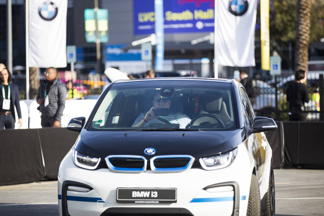The BMW i3 Urban Suite self-driving electric vehicle drives passenger Richard Phillips of Michi ...