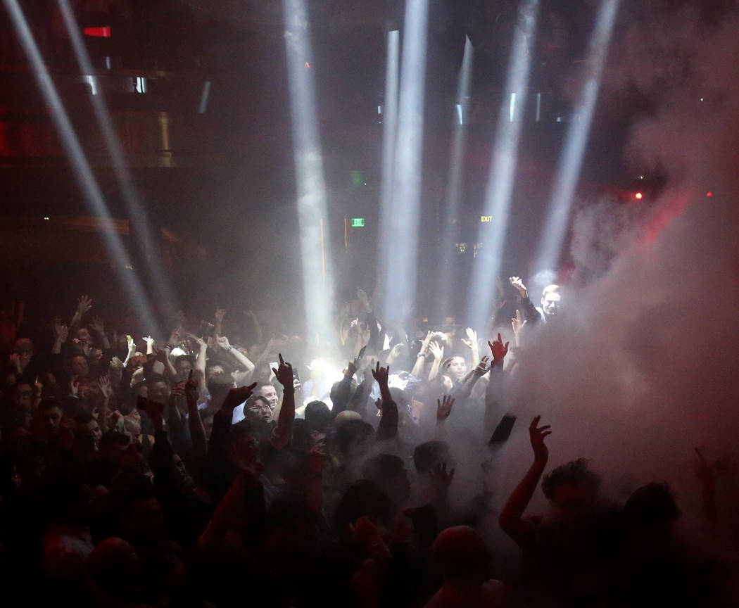 Conventioneers and clubgoers during the CES 2020 official opening party in the Main Room at Omn ...