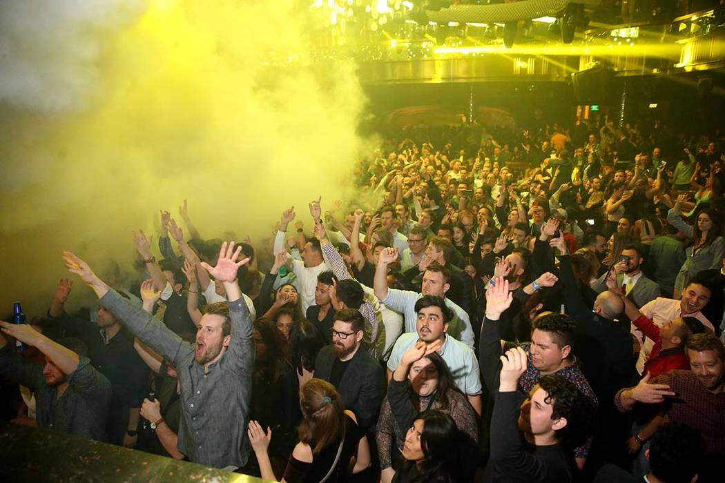 Conventioneers and clubgoers during the CES 2020 official opening party in the Main Room at Omn ...