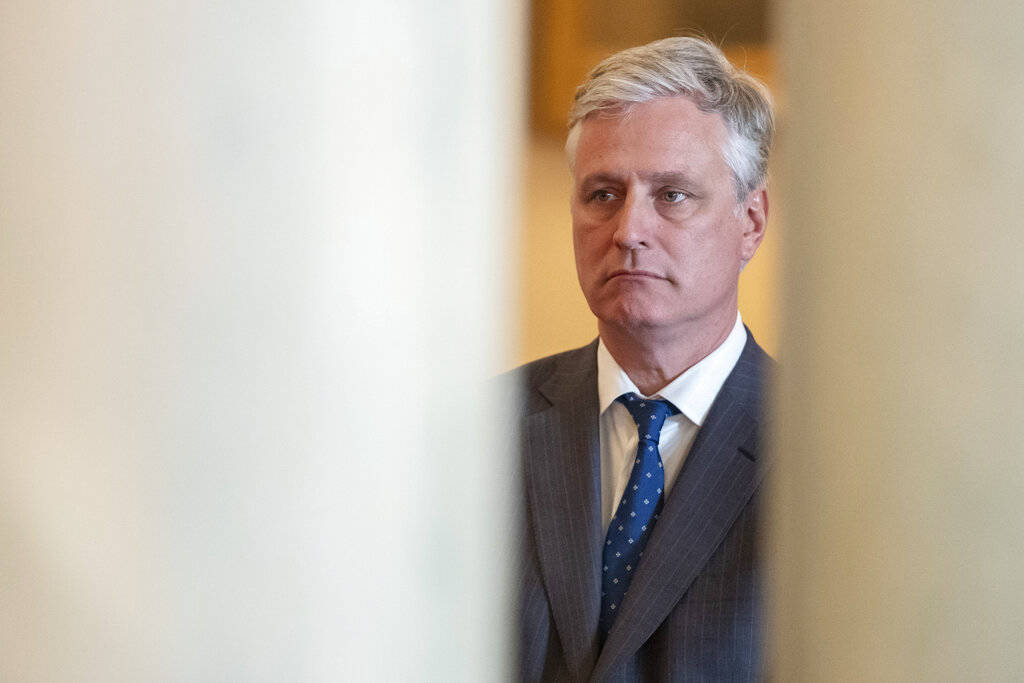 National Security Adviser Robert O'Brien, listens as President Donald Trump addresses the natio ...