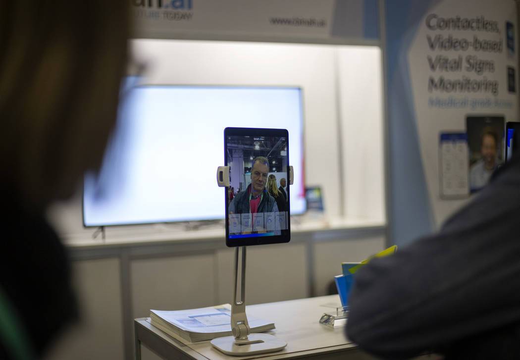 Jean Marie Willot of France tries out the Binah.ai app on Wednesday, Jan. 8, 2020, at CES at th ...