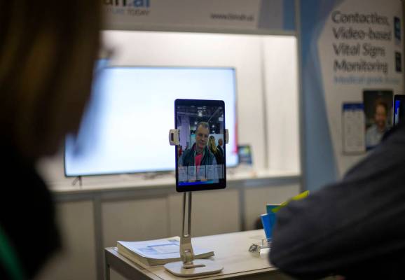Jean Marie Willot of France tries out the Binah.ai app on Wednesday, Jan. 8, 2020, at CES at th ...