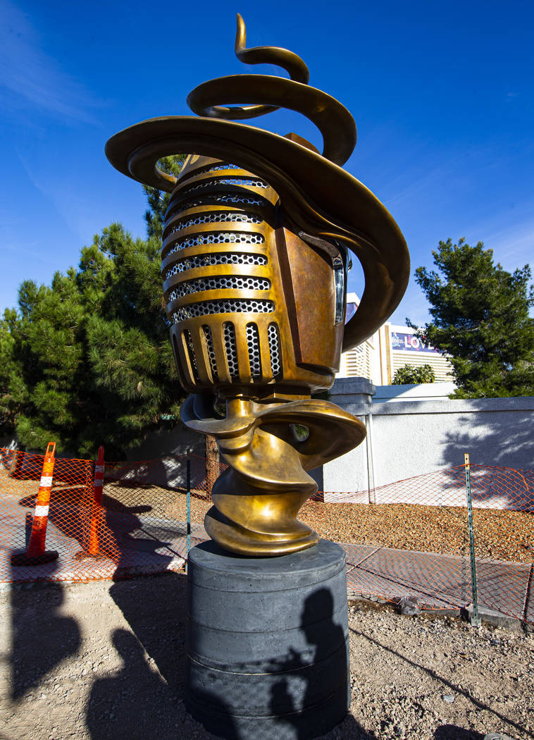 Artist Wayne Littlejohn talks about his sculpture, "Spin Baby," at the intersection o ...