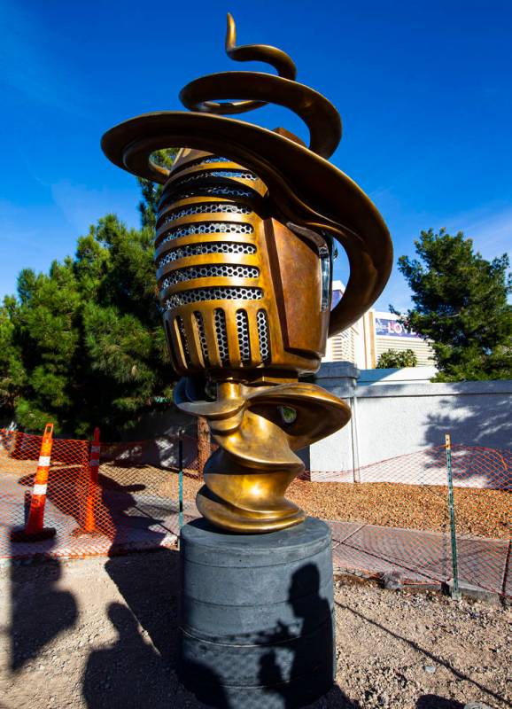 Artist Wayne Littlejohn talks about his sculpture, "Spin Baby," at the intersection o ...