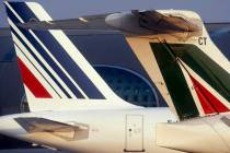 In this undated photo released by Air France, an Air France plane, left, and an Alitalia plane, ...