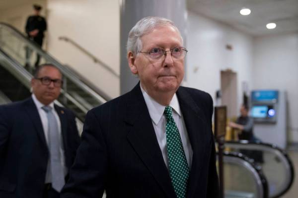 Senate Majority Leader Mitch McConnell, R-Ky., heads to a briefing with Secretary of State Mike ...