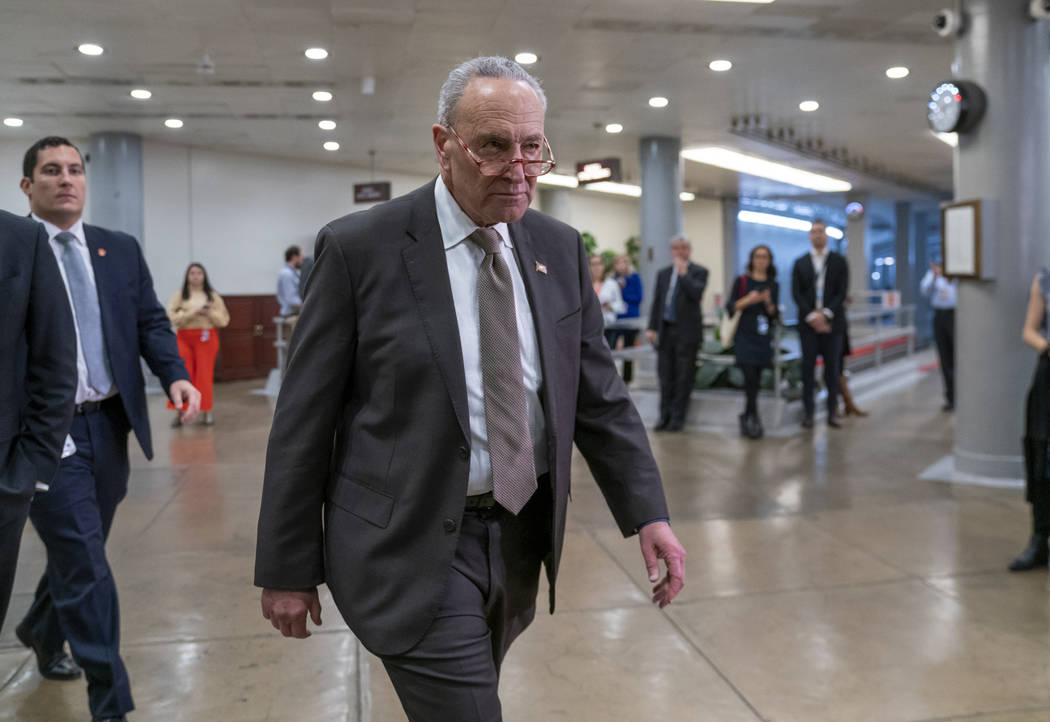 Senate Minority Leader Chuck Schumer, D-N.Y., heads to a briefing by Secretary of State Mike Po ...