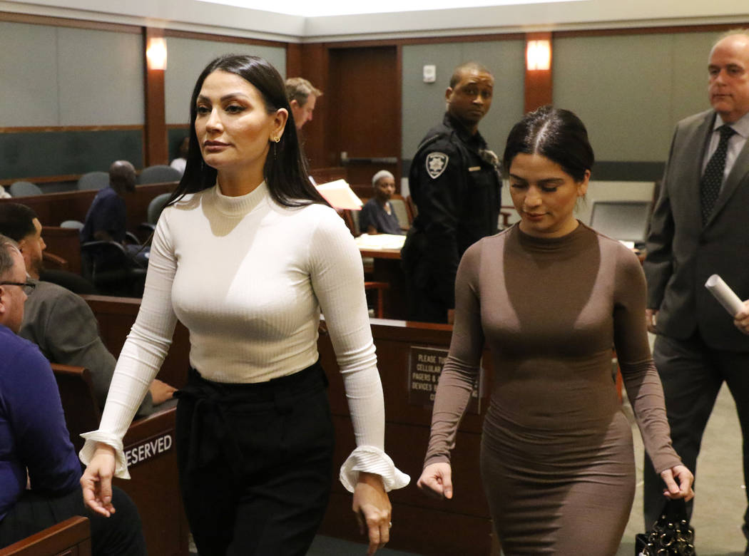 Four women, accused of an attack involving shoes at the Cosmopolitan, leave the courtroom with ...