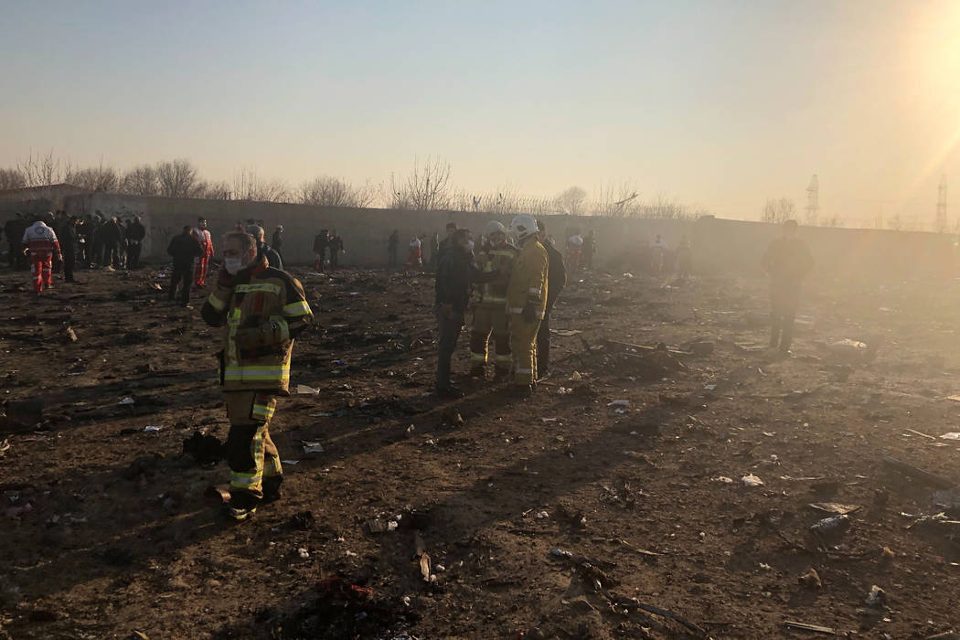 Debris is seen from a plane crash on the outskirts of Tehran, Iran, Wednesday, Jan. 8, 2020. A ...