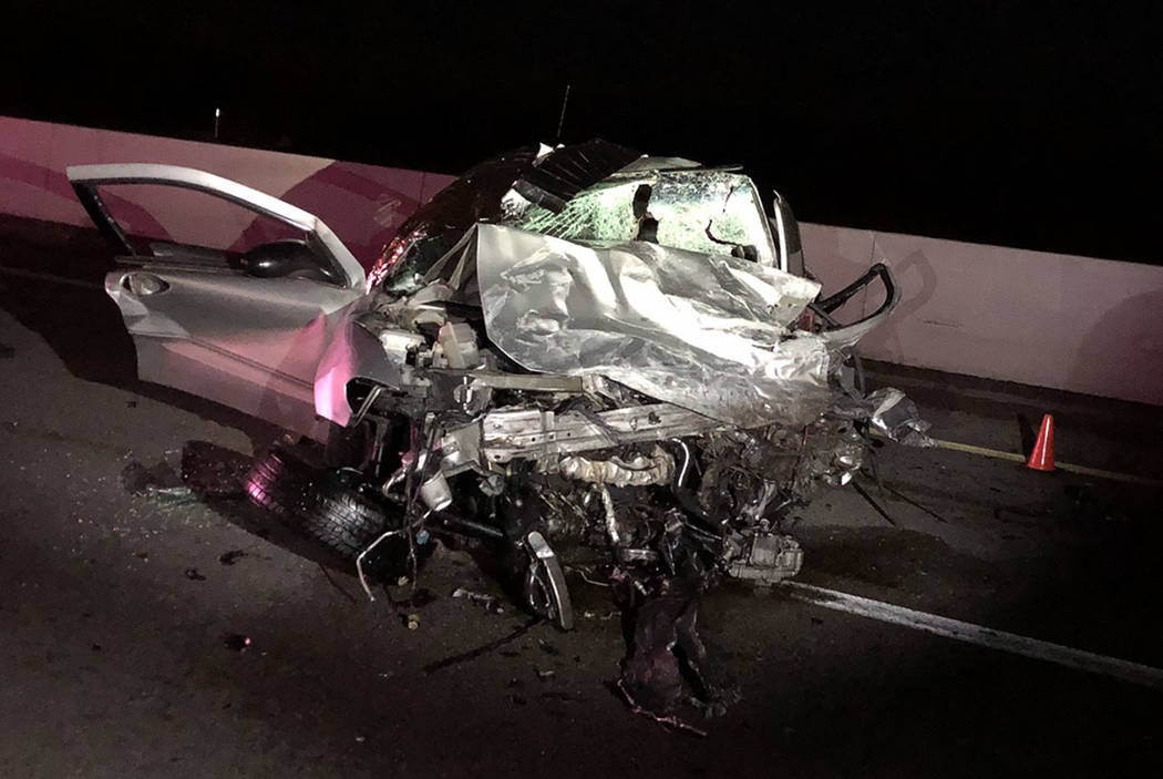 The remains of a vehicle involved in a wrong-way crash that left two people dead on Thursday, D ...