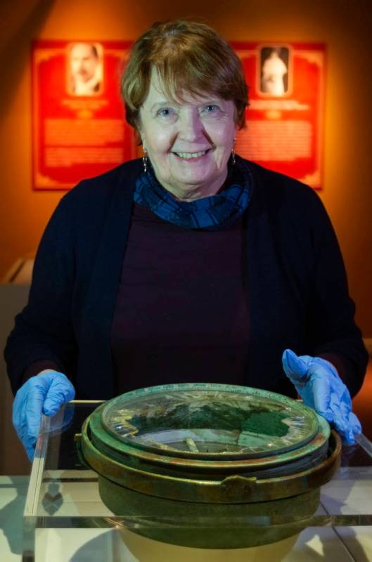 Alexandra Klingelhofer, executive director for collections, with a ship compass recovered from ...