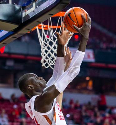 UNLV Rebels forward Mbacke Diong (34) gets off a shot under the rim over Air Force Falcons defe ...