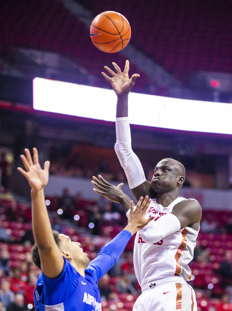 UNLV Rebels forward Cheikh Mbacke Diong (34, right) lets go a shot over Air Force Falcons cente ...