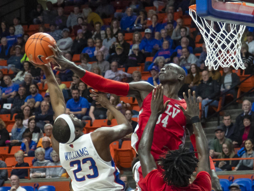UNLV forward Cheikh Mbacke Diong blocks a shot by Boise State guard RJ Williams but is called f ...