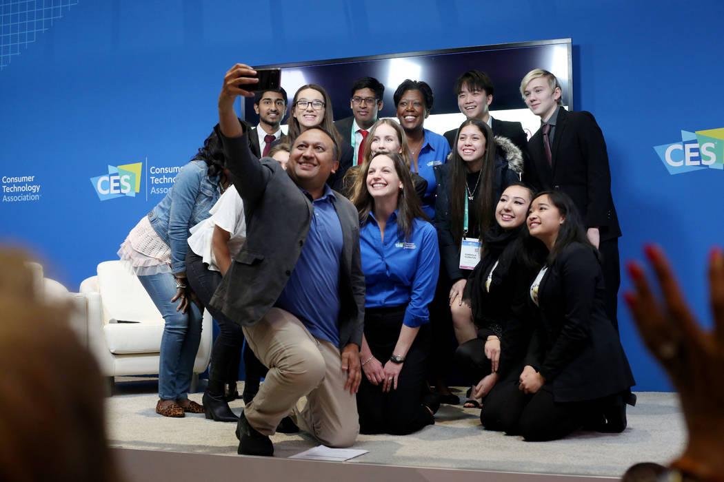 Moderator Snehal Bhakta with Clark County School District takes a photograph with the judges an ...