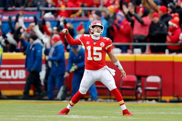 Kansas City Chiefs quarterback Patrick Mahomes (15) reacts after a touchdown by tight end Travi ...
