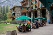 People dine outside the Ahwahnee hotel in Yosemite National Park, Calif., in October 2015. (AP ...