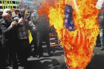 Iranian protestors burn a representation of a U.S. flag. (AP Photo/Vahid Salemi)
