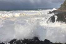 In this Saturday, Jan. 11, 2020, photo strong waves crash on the seashore near Otter Rock in Li ...