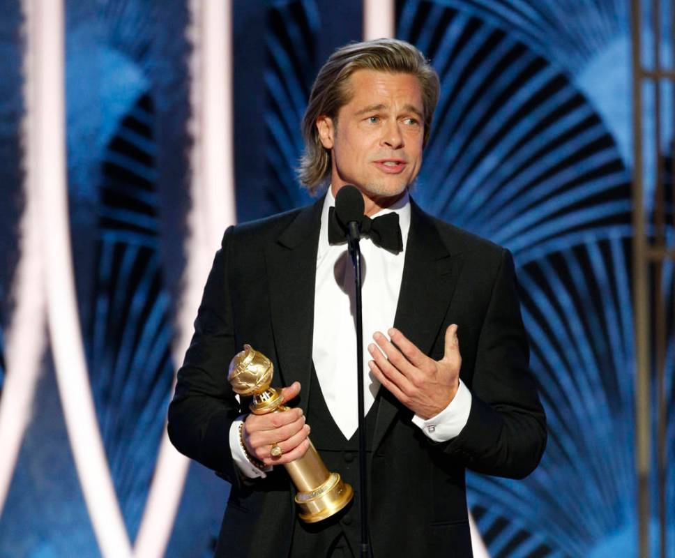 This image released by NBC shows Brad Pitt accepting the award for best supporting actor in a f ...