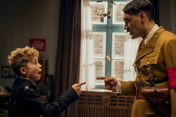This image released by Fox Searchlight Pictures shows, from left, Roman Griffin Davis and Taika ...