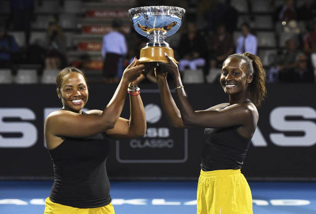Taylor Townsend, left, from the United States and United States player Asia Muhammad with the A ...