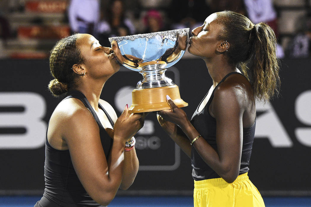 Taylor Townsend, left, from the United States and United States player Asia Muhammad with the A ...