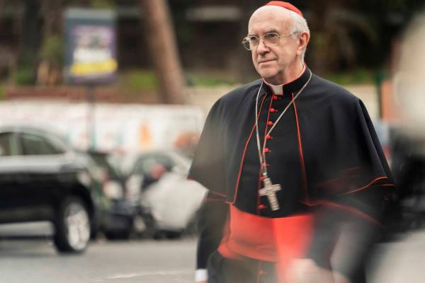 This image released by Netflix shows Jonathan Pryce as Cardinal Bergoglio in a scene from &quot ...