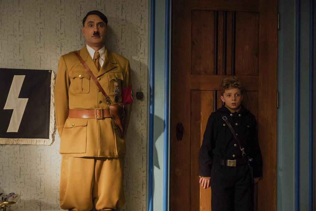 This image released by Fox Searchlight Pictures shows Taika Waititi, left, and Roman Griffin Da ...