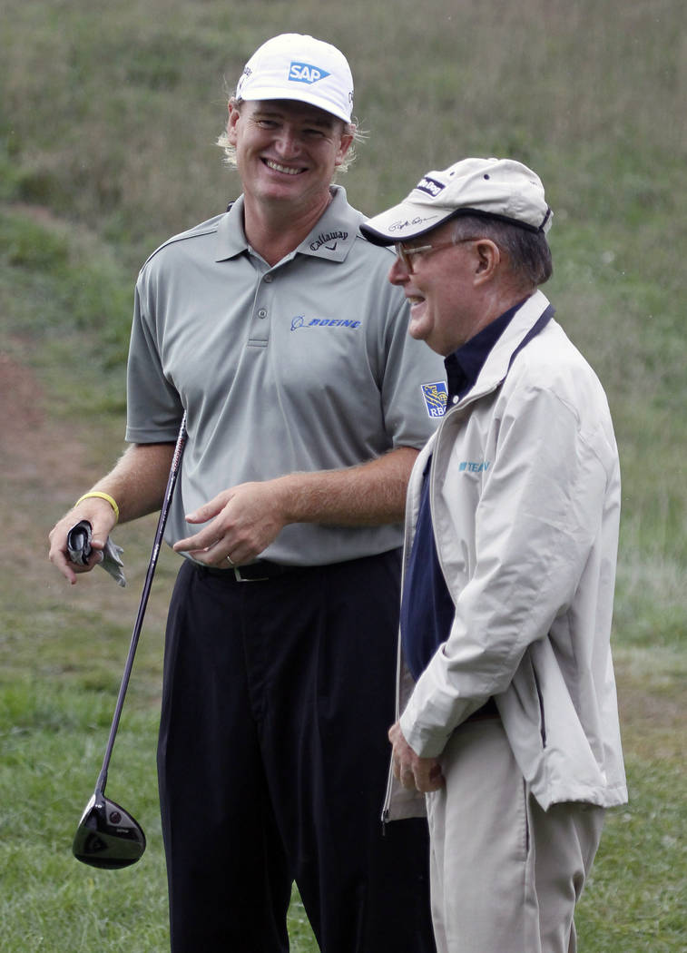 Ernie Els of South Africa, left, laughs with golf course designer Pete Dye during the Pro-Am at ...