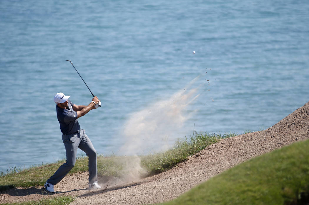 Dustin Johnson hits from a bunker on the third hole during the third round of the PGA Champions ...