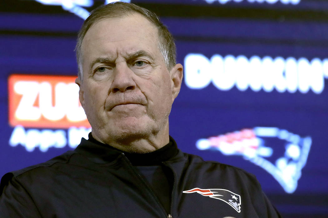 New England Patriots head coach Bill Belichick speaks to the media following an NFL football ga ...
