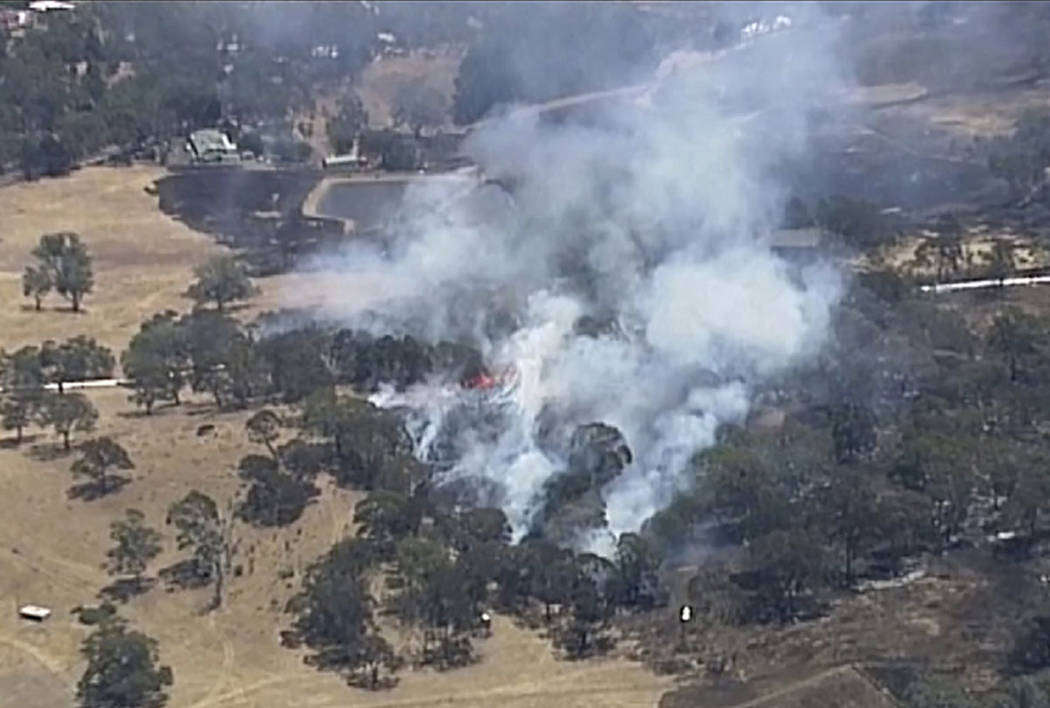 In this image made from video, an aerial scene shows wildfires burning in the Adelaide Hills, A ...